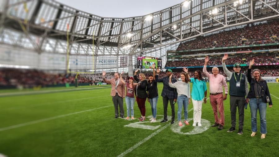 Educators being recognized on-field at a football game