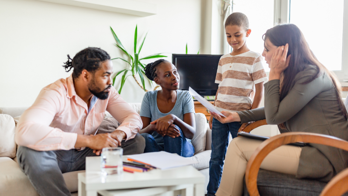 Family sitting talking to a specialist