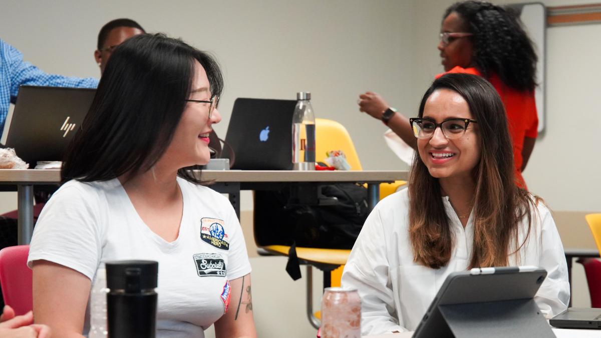 two students in a classroom