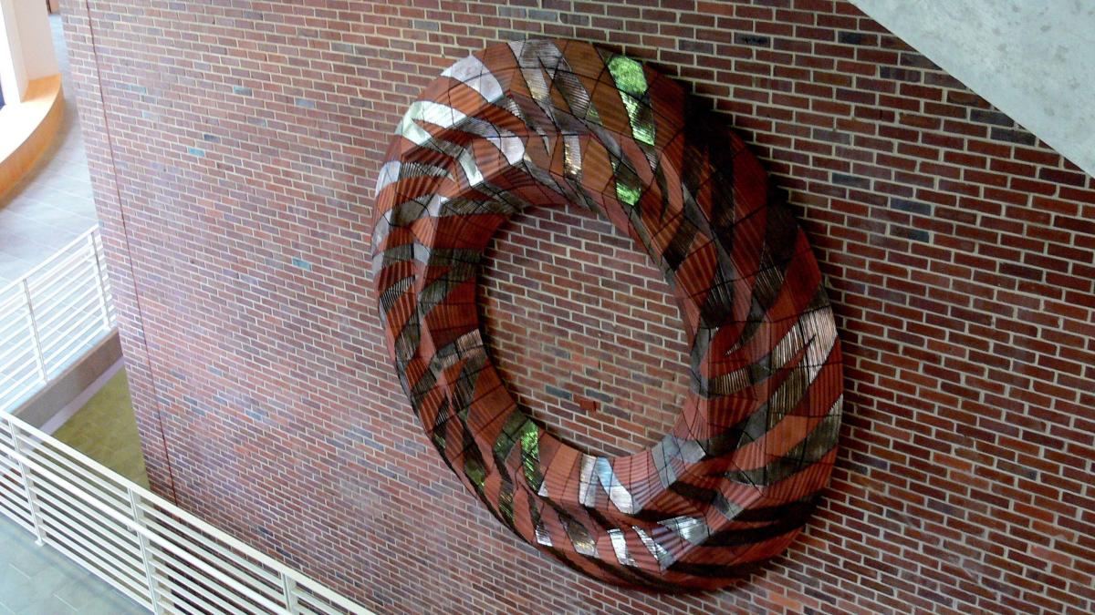 Circular terracotta sculpture in the Stone Building atrium