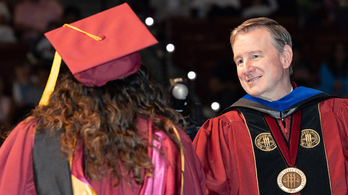 Florida State University President Richard McCullough shakes hands with a graduate during one of the summer commencement ceremonies, Friday, Aug. 1, 2025, at the Donald L. Tucker Civic Center. (FSU Photography)