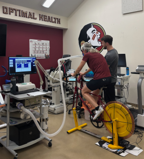 Person exercising on bike in laboratory