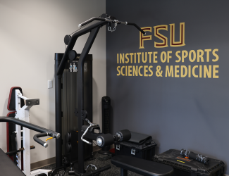 Weight-lifting equipment at the FSU ISSM logo