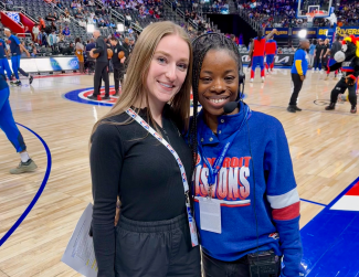 Brooke Brennan and fellow sport management alumna Honesty Franklin on the court