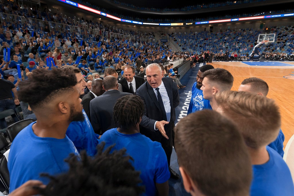 Basketball team timeout with coach
